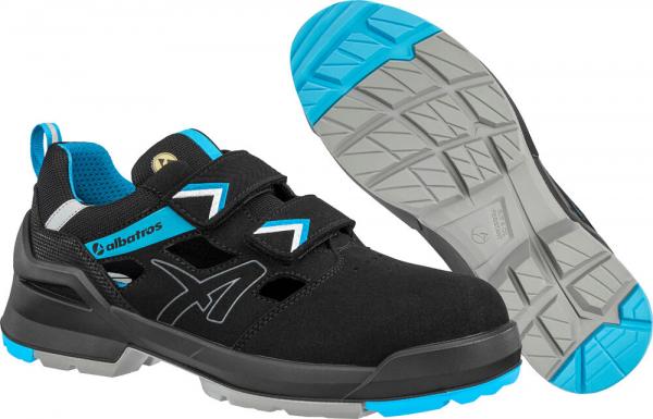 The shoe is black with blue and gray accents. It has two Velcro straps. The sole is sturdy, with a non-slip pattern. It appears sporty and versatile.