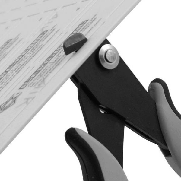 The image shows part of a drafting board with a holder. The holder has two black, curved handles and a reinforced mechanism that holds the board at a specific angle.