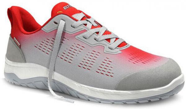 The shoe is sporty, primarily gray with red accents. It has a flat, non-slip sole and a breathable upper structure. The laces are visible.