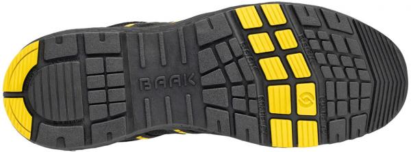 The image shows the sole of a shoe. It is predominantly black with yellow rubber elements. The tread is grippy and features various patterns for better traction. The "BAAK" logo is embossed.