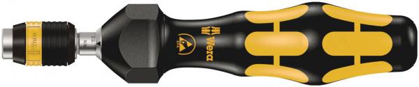 The image shows a screwdriver with an ergonomically shaped, black grip surface and yellow rubber elements. The screwdriver has a hexagonal head and a sturdy, metal tip.