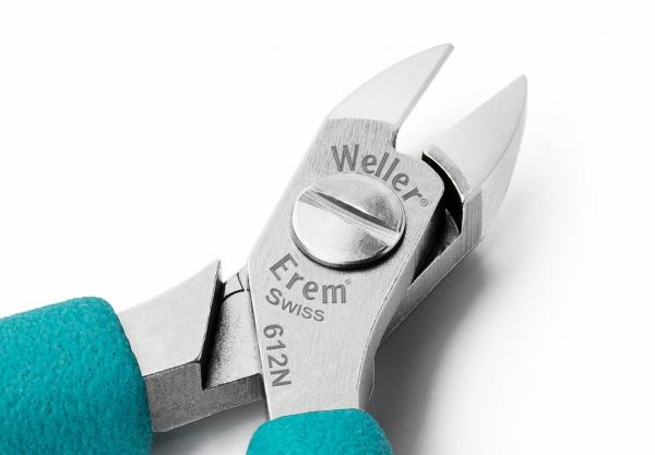 The image shows pliers with a silver metal head and turquoise handles. The jaws are sharp and pointed, ideal for cutting or gripping. There are markings visible on the head.