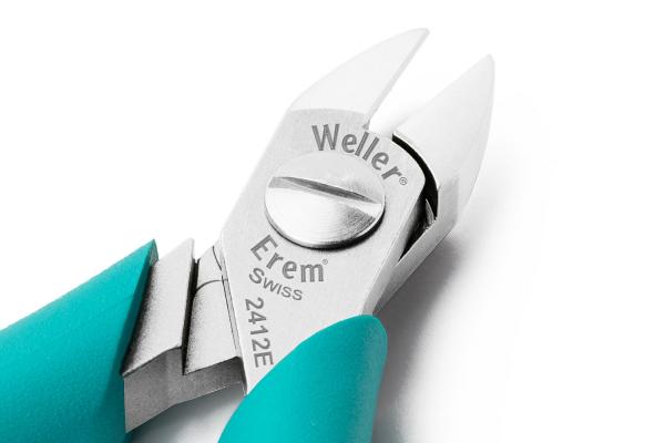 The image shows a precise pair of pliers with a silver head and turquoise handles. The head has a pointed shape for gripping and cutting wires. The brand is clearly visible.