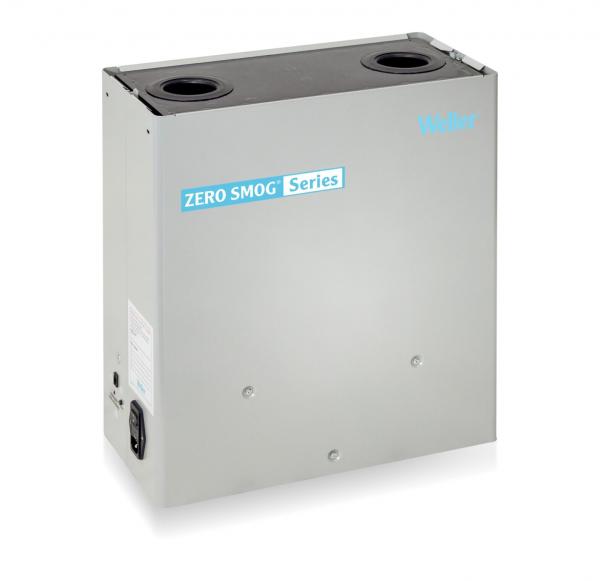 The image shows a compact, square device in silver with a smooth surface. There are two round openings on the top. The front features the inscription "ZERO SMOG Series".