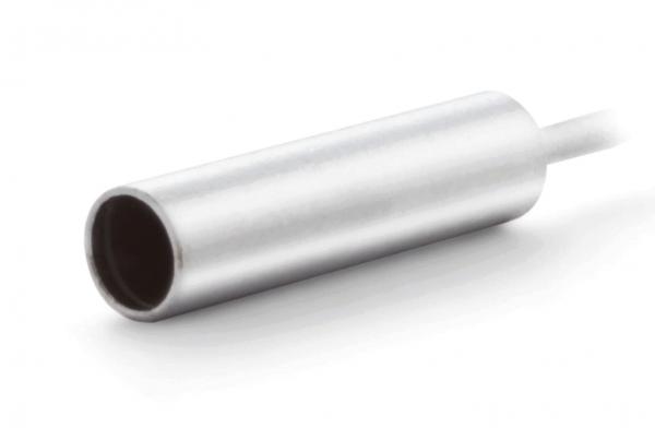 The image displays a silver, cylindrical metal object. At one end, a black hole is visible, and at the other end, a white cable extends.