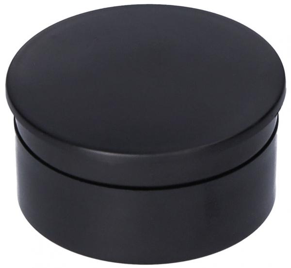It is a round, black box with a flat lid. The surface is smooth and shiny, and the box has a simple, elegant shape.