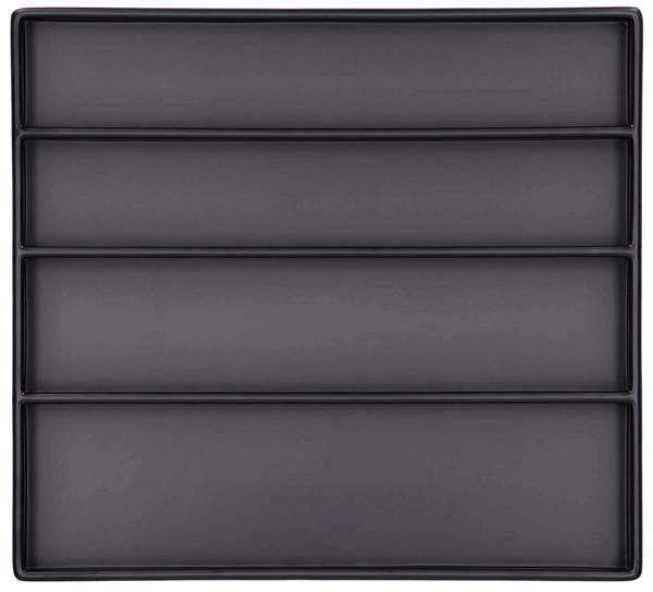 The image shows a flat, square tray in matte black, divided into four equal rectangular compartments. It has a simple, elegant shape.