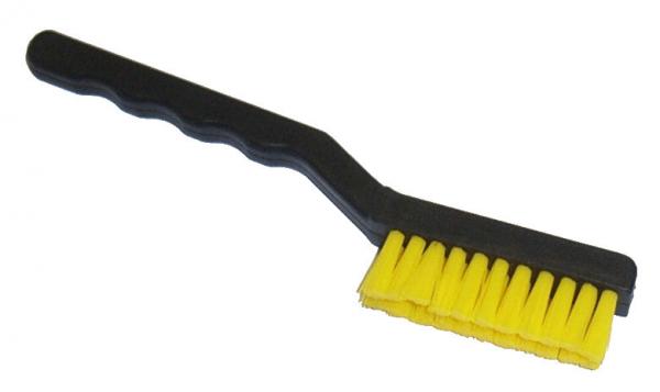 The image shows a small hand brush with a black handle and a brushing surface made of yellow bristles. The bristles are closely spaced and soft.