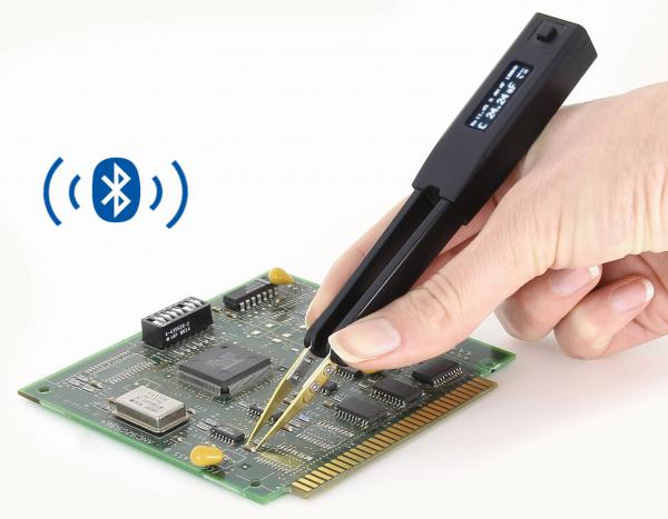 The image shows a hand holding a digital pair of pliers that is working on a green circuit board. Next to the pliers, there is a Bluetooth symbol depicted.