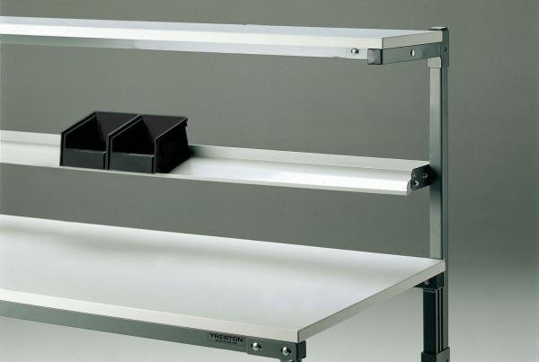 The image shows a shelf with several horizontal shelves. On the top shelf, there are two black storage boxes. The shelf has a metal structure.