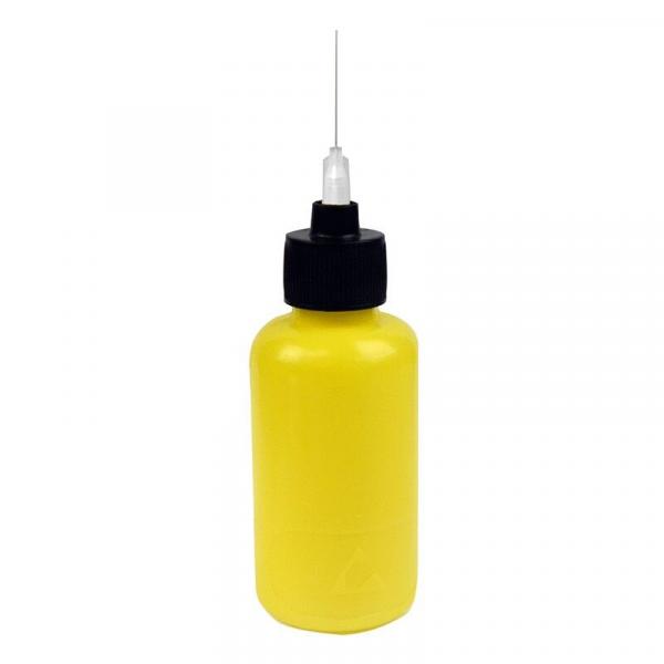 The image shows a yellow bottle with a black cap. A fine, long needle tip protrudes from the cap. The bottle is rounded and has a smooth material.