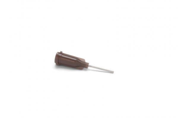 The image shows a brown object with a narrow, silver end. The upper part has a grippy shape, while the end tapers to a point and rests on a hard surface.