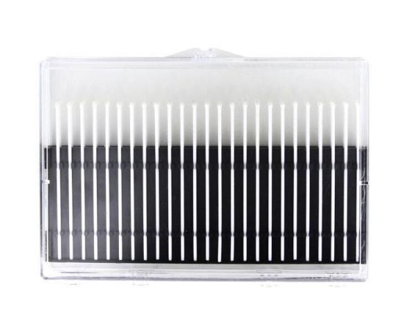 The image shows a rectangular, clear container with several parallel, fine, white and black stripes. It appears structured and could be intended for cosmetic applications.