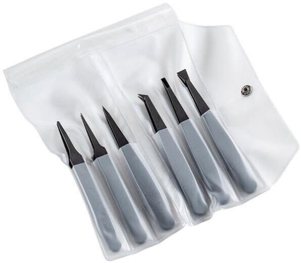 The image displays a transparent storage bag containing six tools. The tools feature gray handles and black tips, each with different shapes for precise tasks.