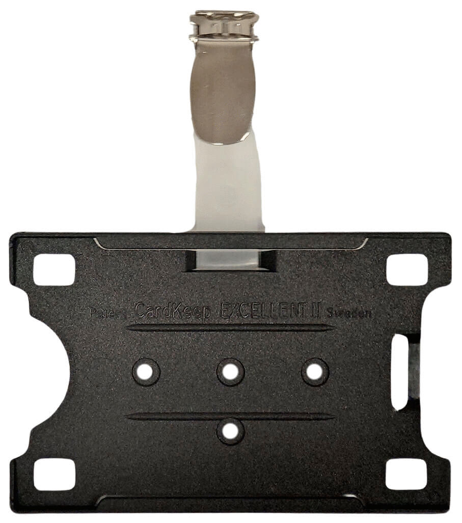 The image shows a black bracket with a metallic connection at the top. The bracket has four holes and a central slot-groove design. It appears sturdy and functional.
