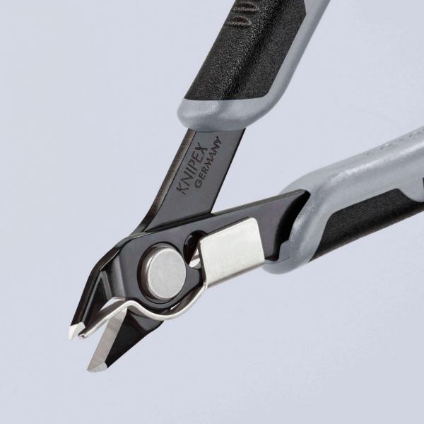 The image shows a special pair of pliers with pointed, curved blades. The handle is black with gray rubber buffers for better grip. The blades are sharp and metallic.