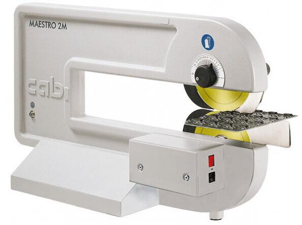 The image shows a machine labeling device in a modern, sleek design. It is predominantly white with a yellow trim circle and a control panel with switches.