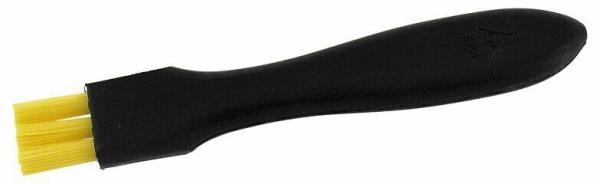 The image shows a brush with a black handle and yellow bristles. The handle is ergonomically shaped and fits well in the hand. The bristles are densely arranged.