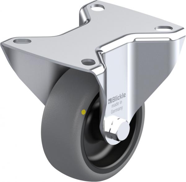 The image shows a slightly curved wheel attached to a metallic bracket. The surface is shiny, the tire is gray with a yellow dot. It is a furniture caster.