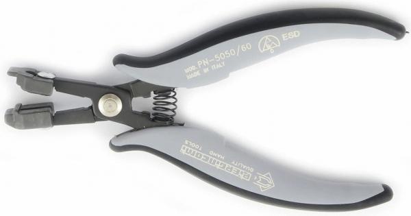 The image shows a pair of pliers with curved, non-slip handles in gray and black. The head has special openings for cutting or gripping objects. It is lightweight and ergonomic.