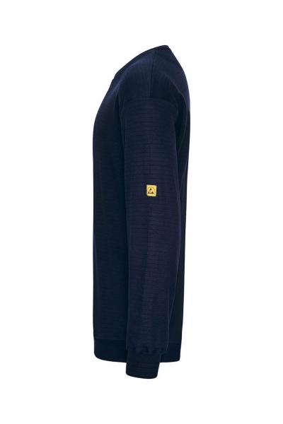 The image shows a long, dark blue sweater. It has a simple cut and a small yellow patch on the sleeve. The texture appears smooth and the sleeves are tight-fitting.