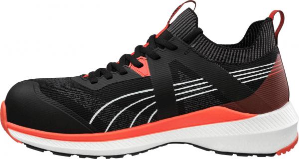 The shoe is sporty, predominantly black with vibrant red and white accents. It features a sturdy sole and a breathable upper, ideal for everyday wear or sports.