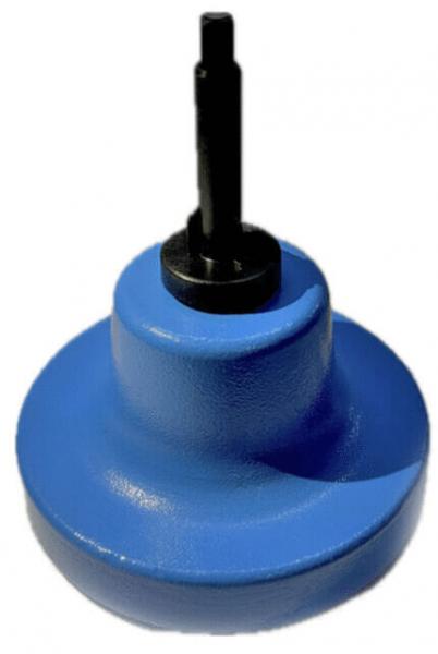 The image shows a blue spinner that stands on a wide, round base. In the center, there is a black, raised handle or pin used for spinning.
