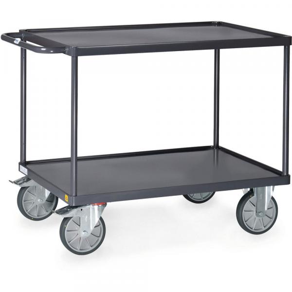 A black serving cart with two flat shelves. It has a sturdy metal construction and four casters that allow for easy movement. There is a handle on one side.