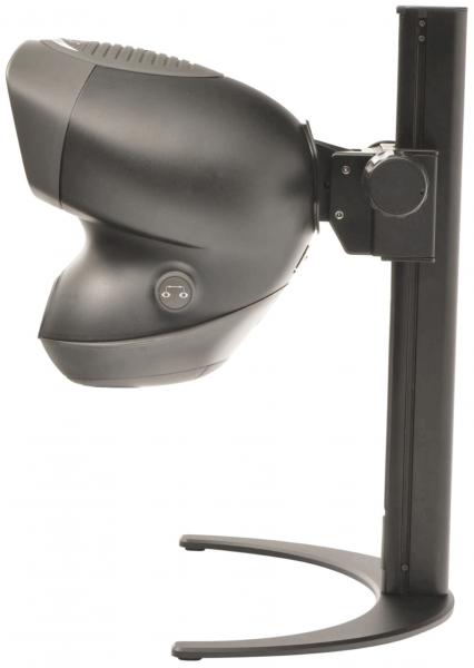 The image displays a black device with a round, dome-shaped top, mounted on a stable base. It features a button on the front and appears compact.