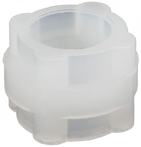 The image shows a transparent, sculptural object with a round opening in the middle. It has a flower-like shape and is slightly wavy at the edges. The surface feels smooth.