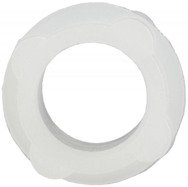 The image depicts a round, white object with an opening in the center. It has a textured surface and wavy edges, giving it a decorative look.