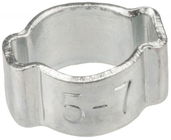 Das Bild zeigt eine silberne, metallene Schelle in U-Form, mit einer markierten Zahl "5-7" auf der Außenseite. Sie hat eine glatte Oberfläche und ist innen hohl.