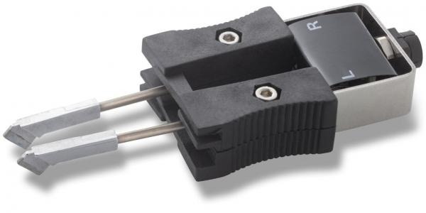 The image displays a technical connector with two metallic contacts. It features a black plastic handle and a control lever marked with the letters "L" and "R".