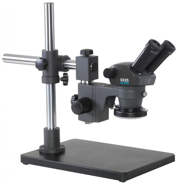 The image shows a microscope with two eyepieces. It is mounted on a sturdy, rectangular base. The stand is made of metal and has an adjustable eyepiece element.
