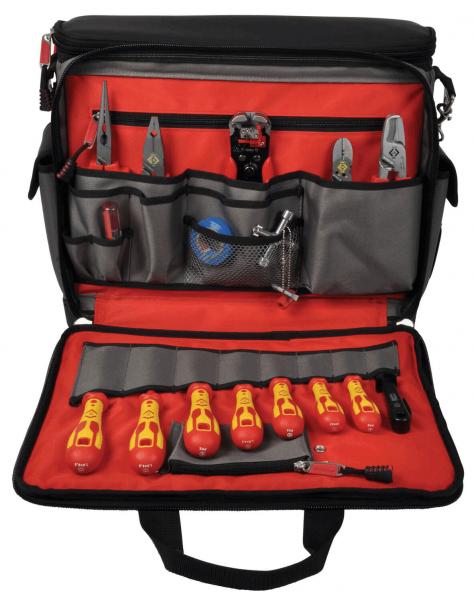 The image shows a tool bag with a red lining. It contains various tools such as pliers, screwdrivers, and a ruler, neatly arranged in compartments.
