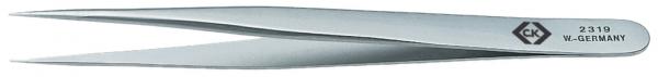 The image shows a shiny, slender metal tweezer. It has two tapering ends that open and close easily, and an engraving that reads "W-GERY".