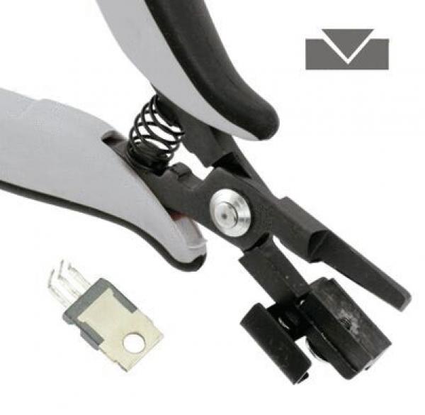Das Bild zeigt eine schwarze und graue Zange mit einem federnden Mechanismus. Neben der Zange liegt ein kleiner, schwarzer Clip. Oben rechts ist ein einfaches Symbol mit einem Pfeil nach unten zu sehen.