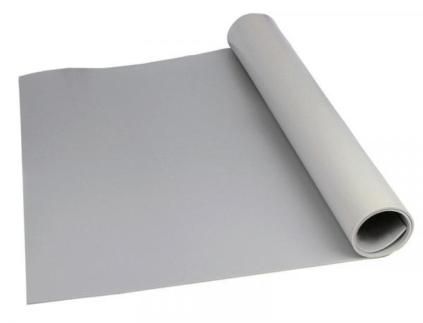 The image shows a roll of gray paper, partially unrolled. The surface is smooth and matte, and the paper is lying on a flat surface.