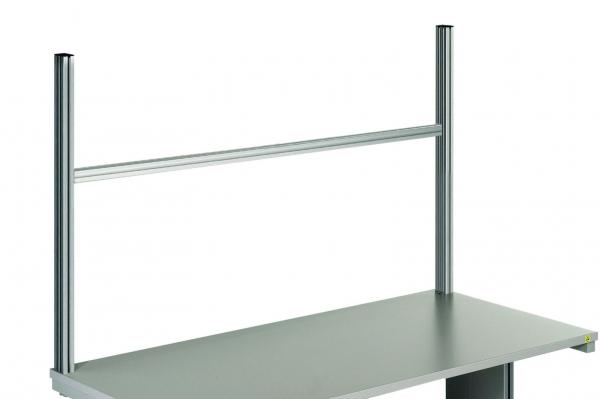 The image displays a simple, gray table with two vertical, metallic supports on each side. A horizontal bar runs along the top of the supports.