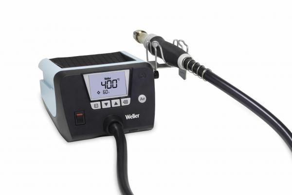The image shows a Weller heating station with a digital display, to which a hot air nozzle attachment is connected. The station has a black body and a blue top.