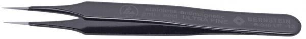 In the picture, there are black, fine tweezers. They have narrow, pointed tips and a sleek design. The handle is slightly curved for precise work.