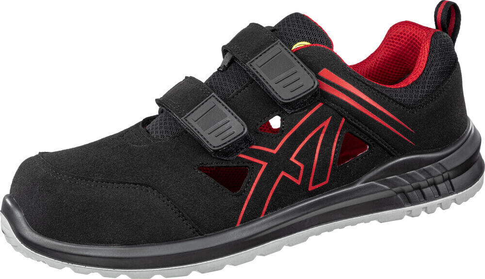 Der Schuh ist schwarz mit roten Akzenten. Er hat zwei Klettverschlüsse und einen sportlichen Look. Die Sohle ist rutschfest, und die Innensohle ist rot und atmungsaktiv.