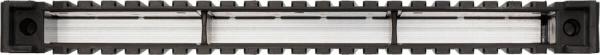 The image shows an elongated, rectangular structure in black with clear, transparent elements in the middle. The edges are serrated, and there is a round cutout at each end.