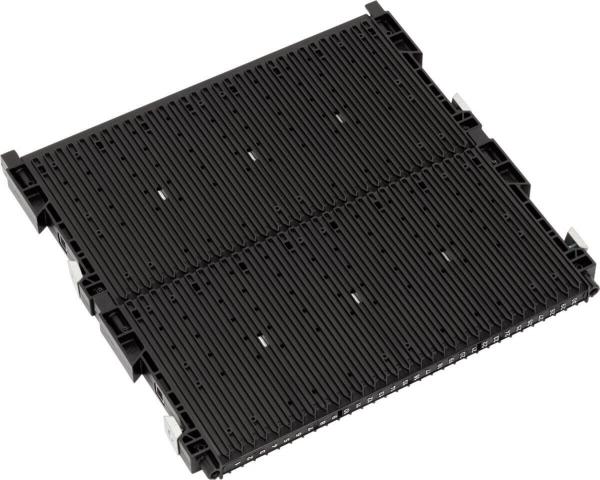 The image shows a rectangular, black plastic plate with many parallel grooves. It has small hooks or tabs on the edges and appears sturdy and flat.