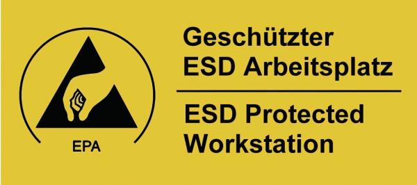 The image shows a yellow warning sign with a black triangle and a hand. Below it, in two languages, it reads "Geschützter ESD Arbeitsplatz" and "ESD Protected Workstation".