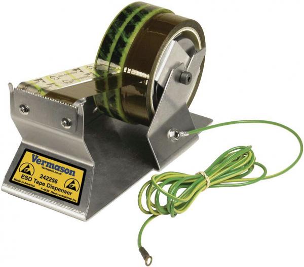 The image shows a sturdy, silver-colored tape dispenser with a large roll of brown, ESD-safe adhesive tape. A green grounding cable is attached.