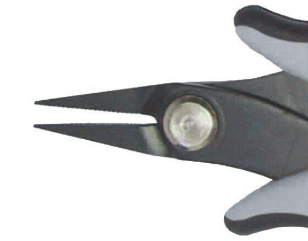 The image shows the tip of a pair of scissors. The handles are gray and black, and the blade is narrow and pointed. A screw head is visible in the center.