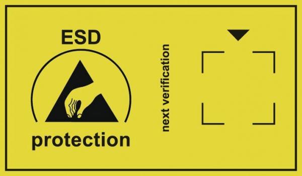 Das Bild zeigt ein gelbes Schild mit einem Symbol für ESD-Schutz (eine Hand, die einen Pfeil berührt). Daneben steht ?nächste Überprüfung? mit einem Pfeil nach unten.