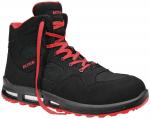 Preview: The shoe is a black, knee-high sneaker with red accents. It features thick laces, a grippy sole, and mesh-like inserts for ventilation. The brand 