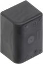 Preview: The image shows a small, black block with rounded corners. The surface is smooth and matte. On the underside, there are some small indentations and symbols.